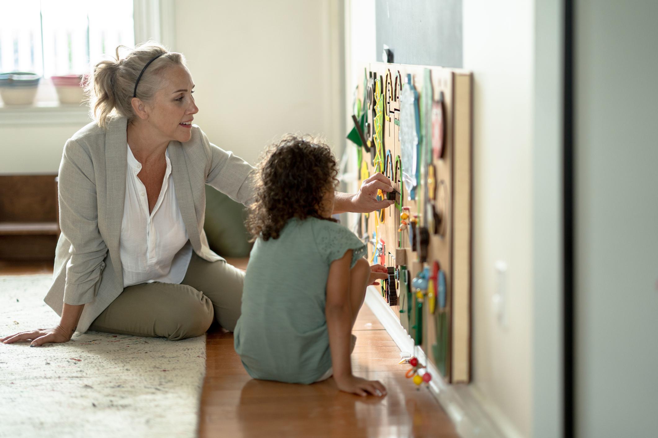 teacher playing with child